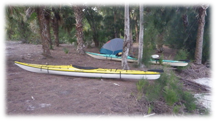 Kayaks and a tent in the woods

Description automatically generated
