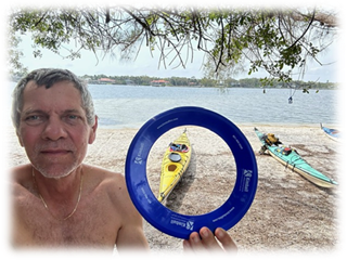A person holding a blue circle

Description automatically generated