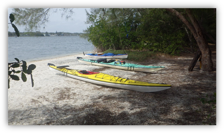 Several kayaks on a beach

Description automatically generated