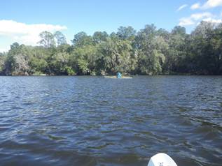 A person in a kayak on a lake

AI-generated content may be incorrect.